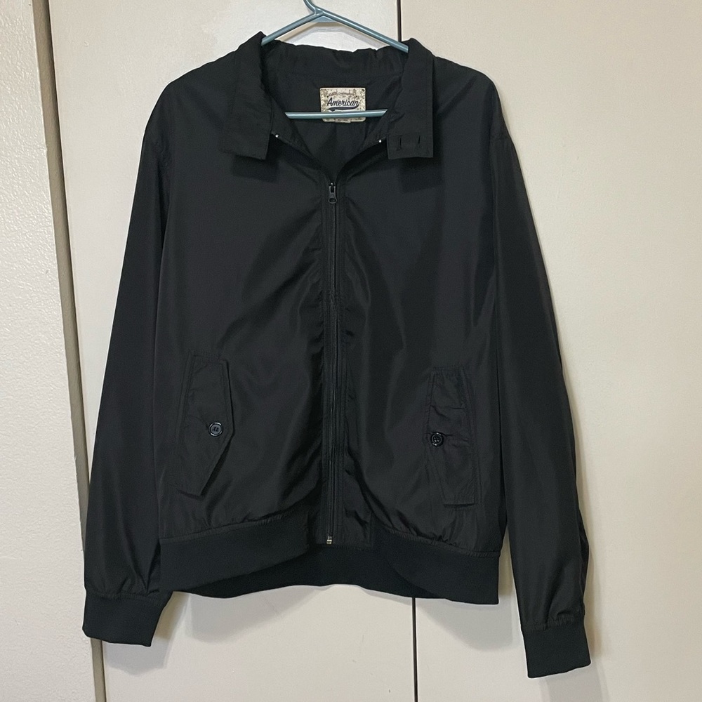 Black windbreaker in the style of a bomber jacket. Size Large.
